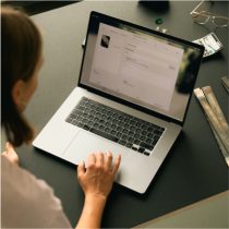 Image of person working on laptop at a desk