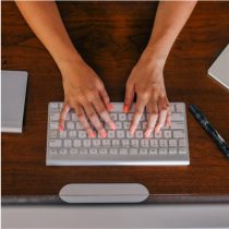 Image of person typing on keyboard